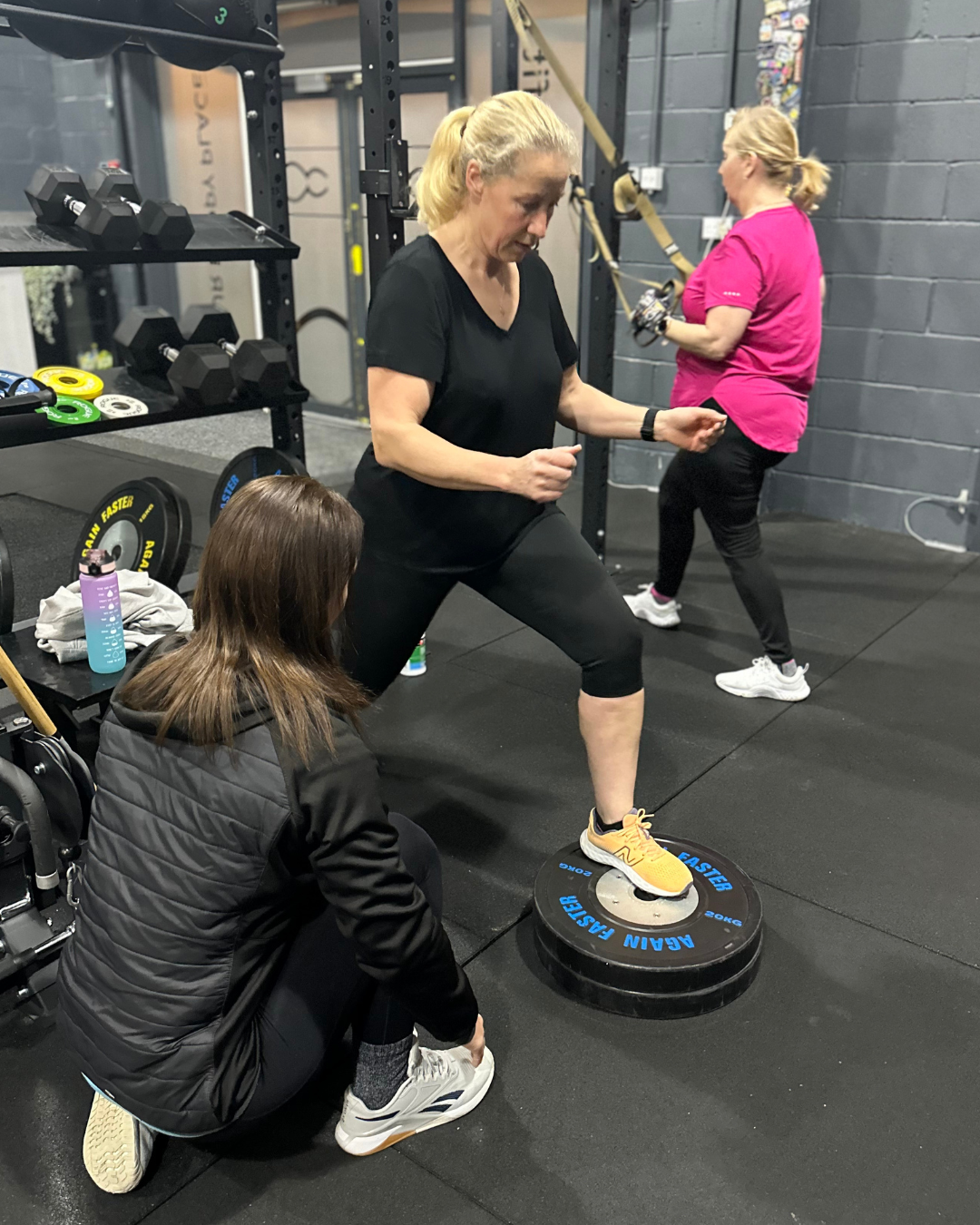 Coach and member working together